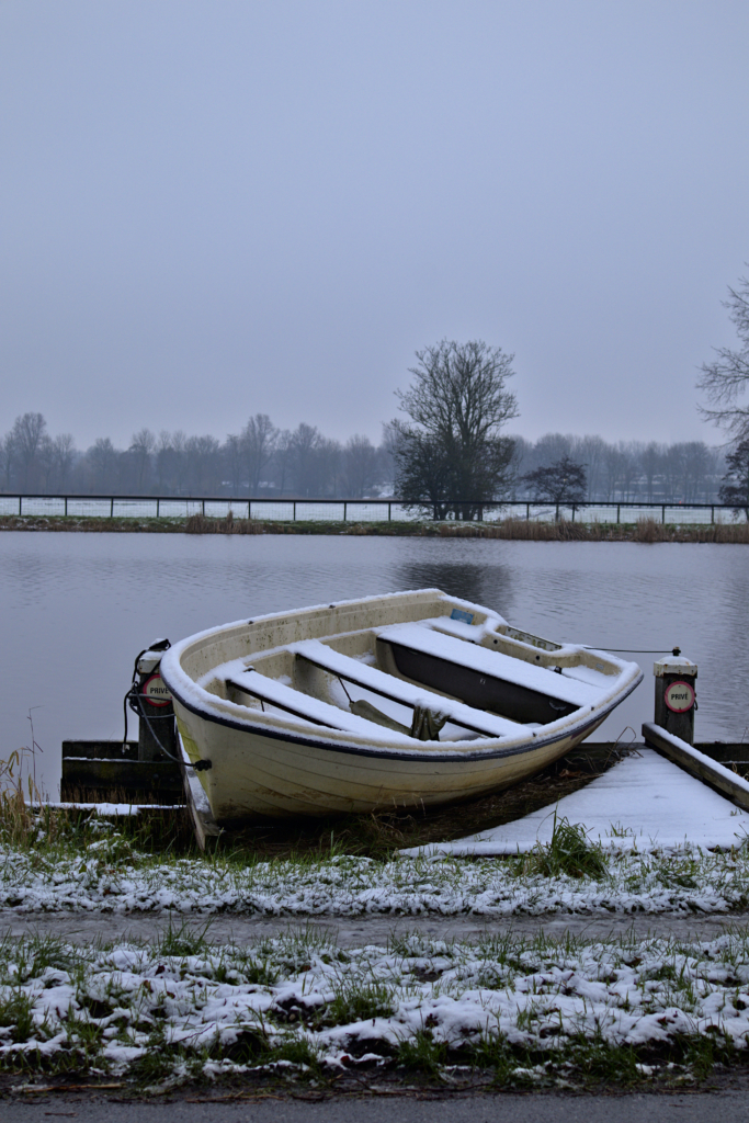 Small boat on the Amstel Amsterdam, the Netherlands.